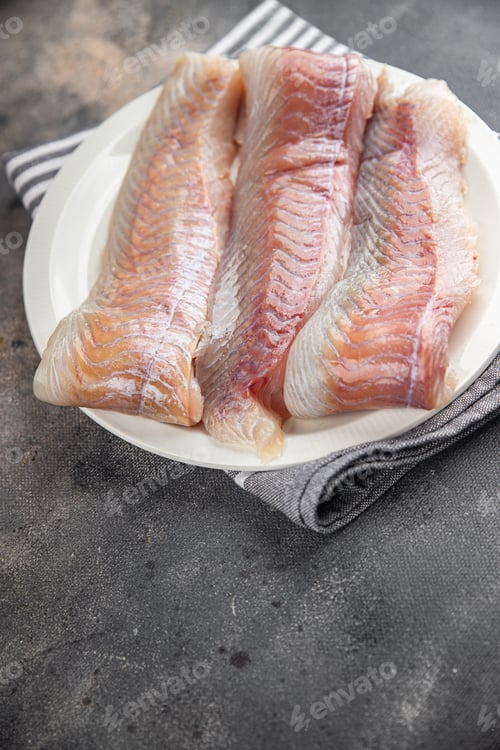 Preview: fillet raw white fish cod or halibut fresh meal food snack on the table copy space food background