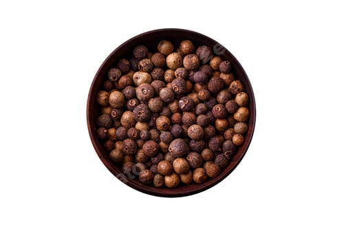 Preview: Spice allspice brown color not ground in a wooden saucer. Asian food