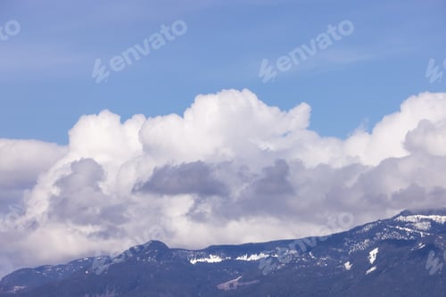 Preview: Puffy Clouds over Canadian Mountain Landscape, Sunny Day.
