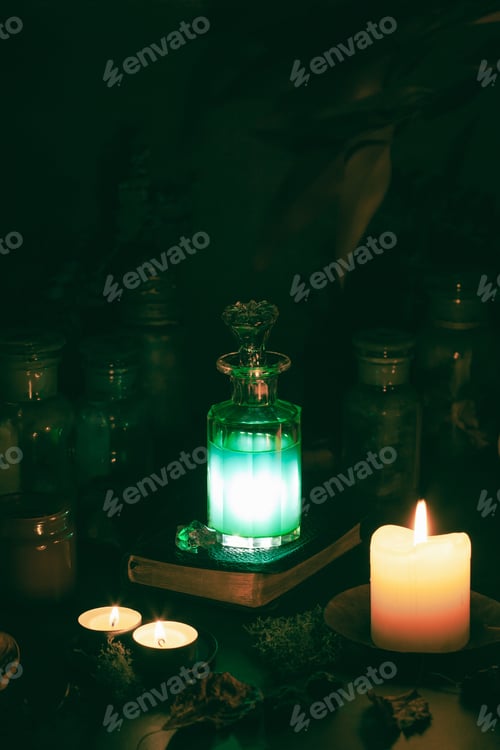 Preview: Illuminated Potion Bottle Amongst Candles and Moss
