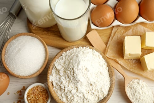 Preview: Fresh ingredients for delicious homemade cake on white wooden table