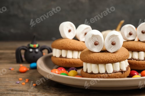 Preview: Delicious Halloween themed desserts on wooden table, closeup