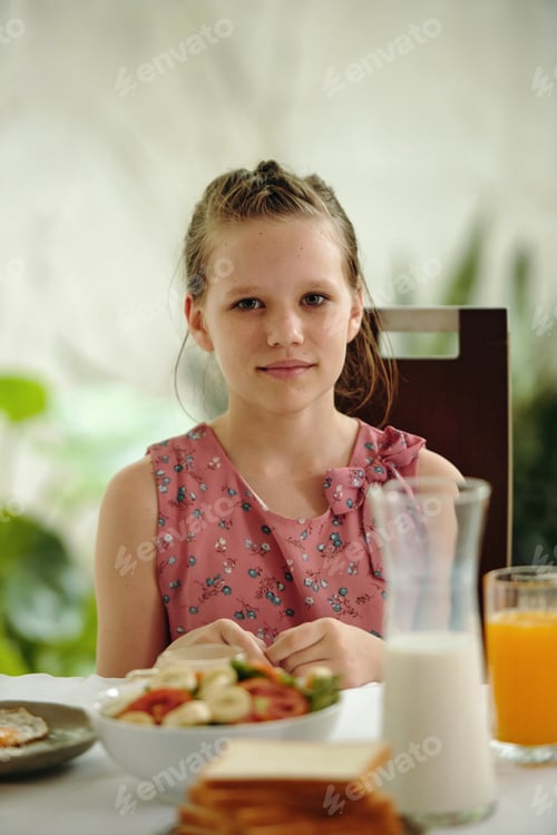 Preview: Girl Sitting At Dining Table