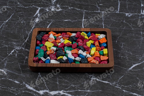 Preview: A tray of colorful candies , on the marble background