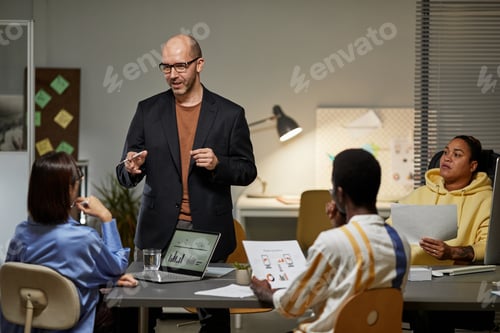 Preview: Business Leader Talking to Team at Meeting