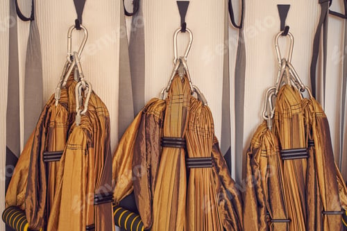 Preview: Yellow yoga hammock swings on the wall