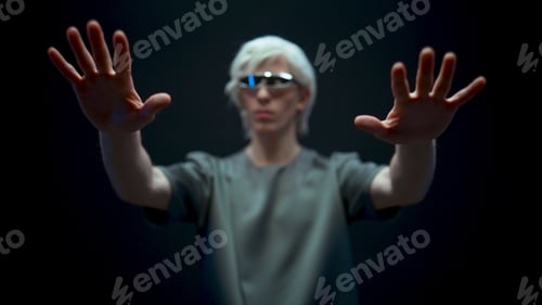 Preview: Man working metaverse in virtual reality world. Male touching invisible objects
