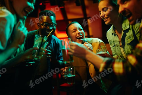 Preview: African American woman singing and having fun while partying with her friends at nightclub.