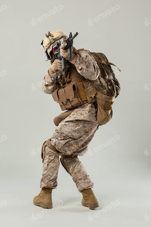 Preview: Military personnel in combat stance with weapon and gear during training session