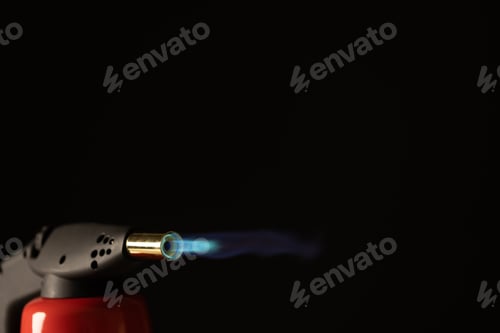 Preview: Close up of lit torch light with copy space on black background