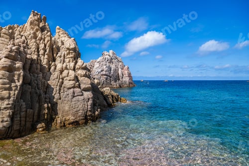 Preview: Scenic Sardinia Shoreline With Rocks and Clear Water at Beach