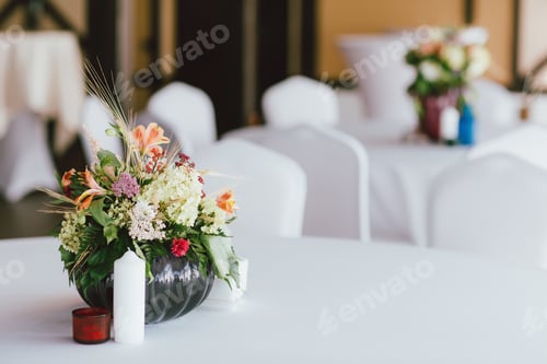 Preview: Bouquet of different flowers in a vase on the table, preparing for event, wedding
