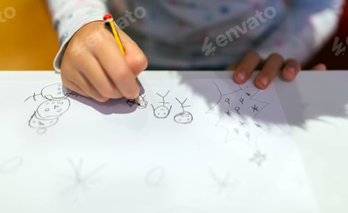 Preview: Hands of drawing little girl, close-up