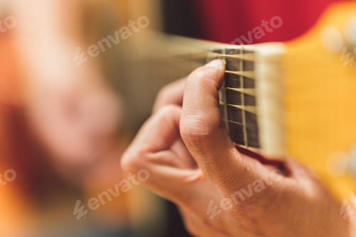 Preview: Person playing a classical guitar