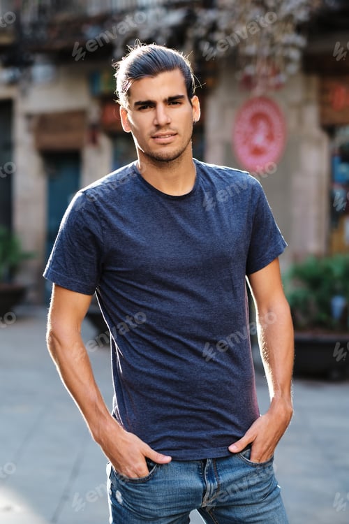 Preview: young top latin model looking at camera with blue t-shirt