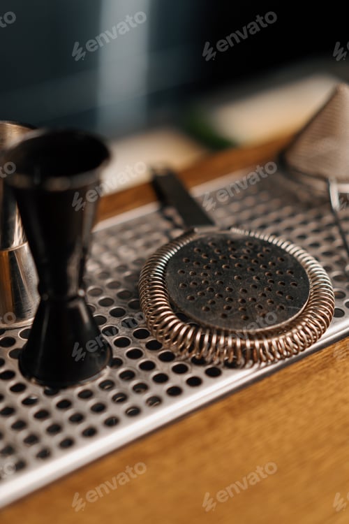 Preview: cocktail utensils jigger cocktail mixer strainer shaker on bar concept of alcoholic beverages