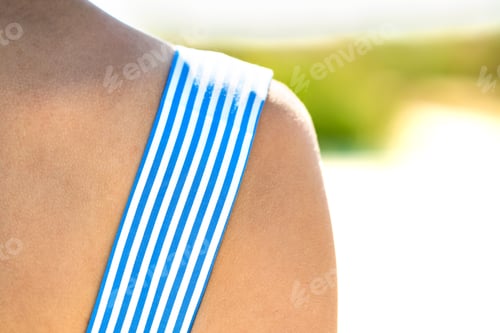 Preview: Close up of young woman wearing summer dress outdoors