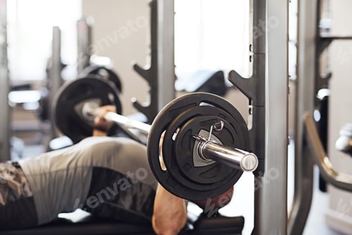 Preview: Man Lifting Weights in Gym Weight Training