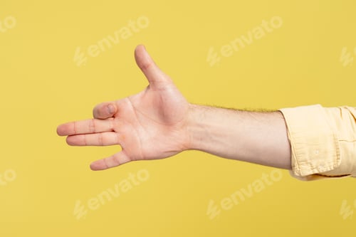 Preview: Hand gesturing like a barking dog on yellow background