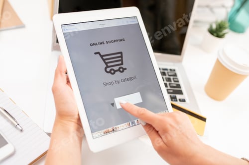 Preview: Hand of young mobile shopper pointing at search line on touchscreen