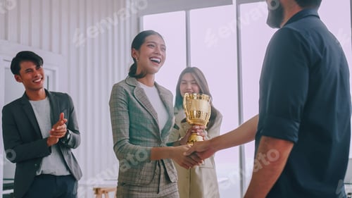 Preview: An employee of the company is proud to receive an award for a successful project.