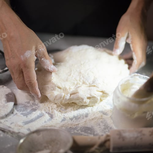Preview: Baking at home. Homemade dough. Baker kneading dough on table