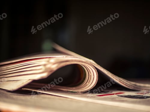 Preview: close up wrinkled newspaper on the table in the dark room