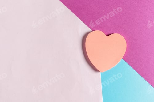 Preview: Colorful paper background with heart shape in center during creative activity