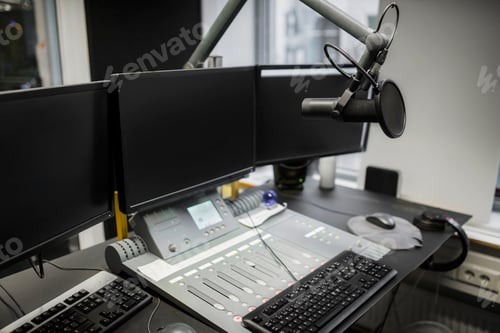 Preview: Monitors And Microphone Over Table In Radio Studio