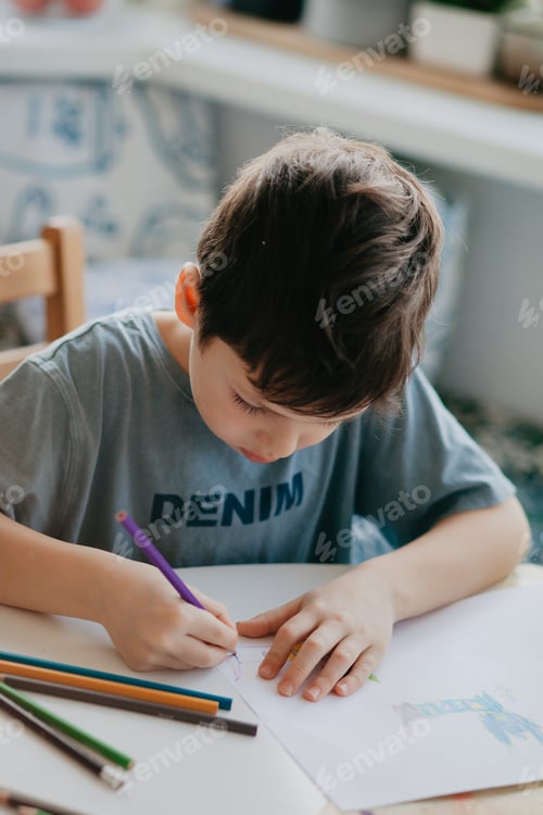 Preview: 5years old boy preschool draws with a pencil