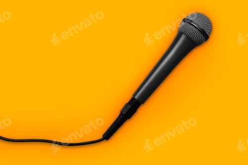 Preview: Microphone for karaoke with a wire isolated on a yellow background - Clipping path