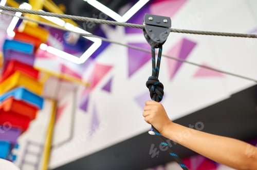 Preview: Boy's hand on zip line in entertainment center