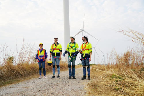 Preview: Sustainable energy industry - Engineers working at alternative renewable wind energy farm