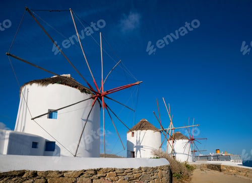 Preview: Traditional greek windmills on Mykonos island at sunrise, Cyclades, Greece