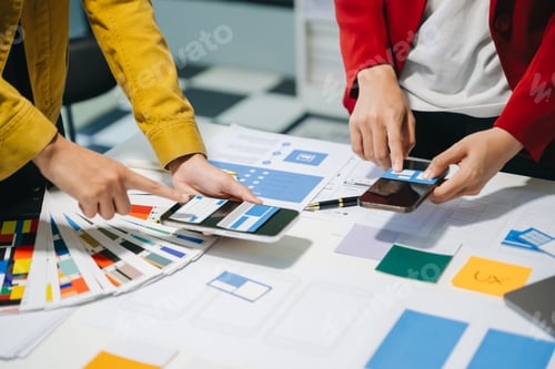 Preview: UX developer and ui designer brainstorming about mobile app interface wireframe design