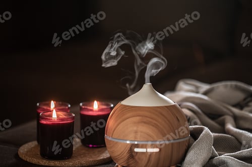 Preview: Modern oil aroma diffuser wiht decor details copy space.