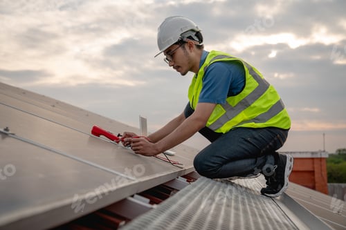 Preview: Service engineer checking solar cell on the roof for maintenance if there is a damaged part.