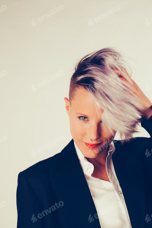 Preview: Portrait of a young woman with dark tailcoat shot in studio