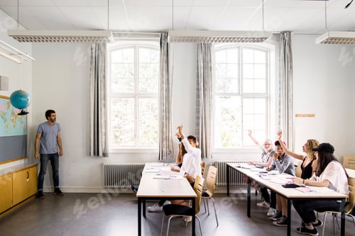 Preview: Students Learning in Classroom with Teacher Present