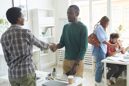 Preview: African-American Man Shaking Hands with Coworker