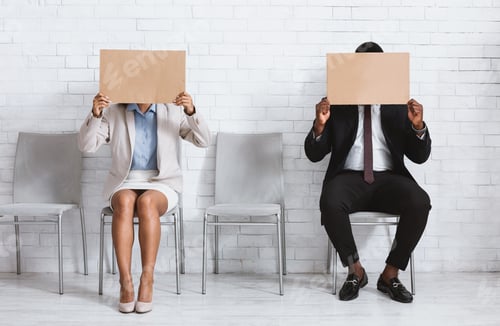 Preview: African American job applicants closing their faces with blank signs at company office, space for