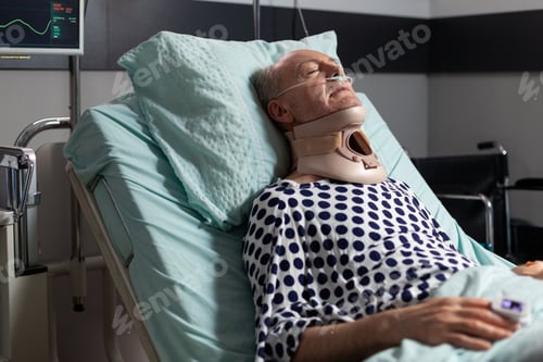 Preview: Elderly man laying in hospital room bed wearing cerival collar