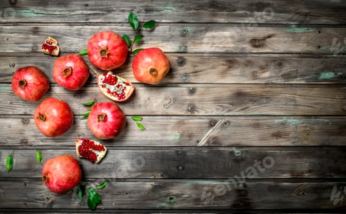 Fresh Pomegranates on a Weathered Wooden Table