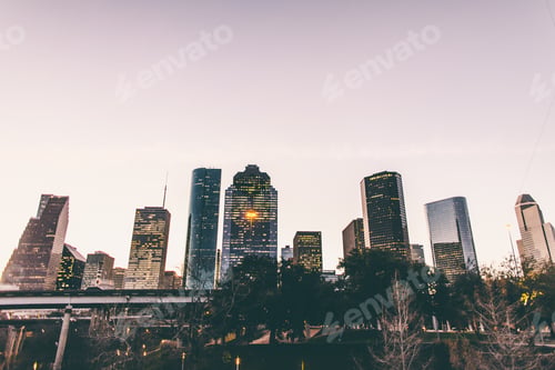 Preview: City Skyline at Dusk Reflects in Water