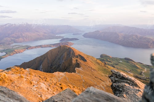 Preview: Landscape of Roys Peak surrounded by a river under the sunlight in New Zealand