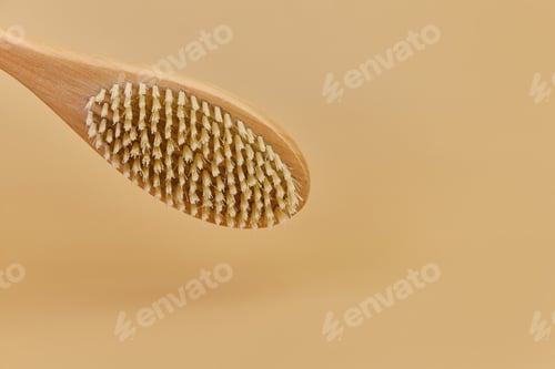Preview: wooden massage brush with natural bristles on beige background