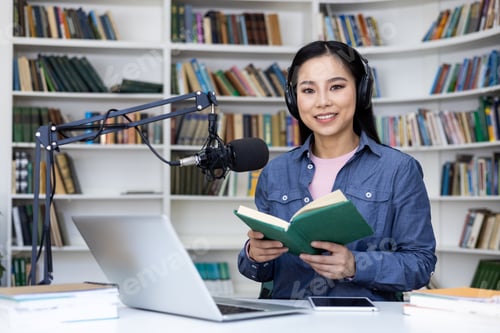 Preview: An Asian woman prepares to record a podcast while reading a book in a library setting.