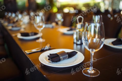 Preview: Sparkling glassware stands on long table prepared for wedding dinner.