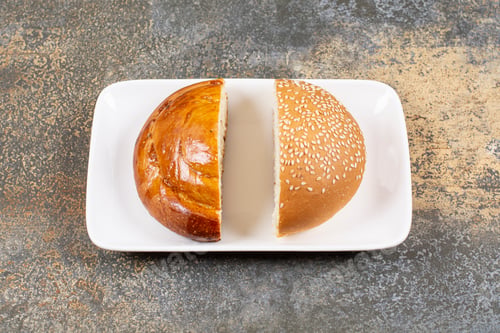 Preview: Half cut fresh pastry and bun on white plate