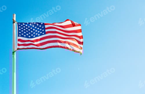 Preview: Low angle shot of the American flag standing on its own outside during the day